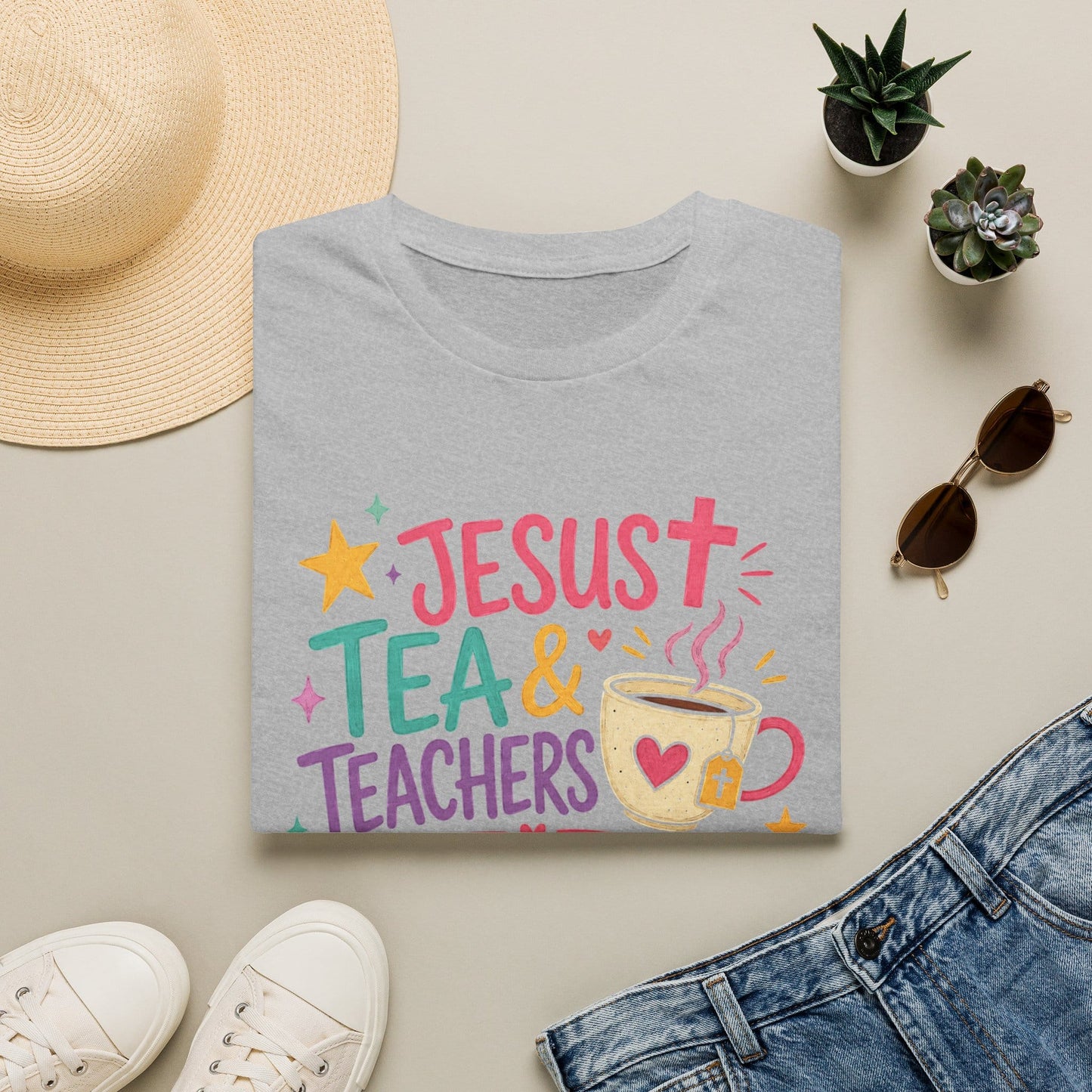 Jesus Tea and Teachers Changing Lives shirt with colorful lettering, teacup, cross tea tag, hearts, stars, and playful classroom style.