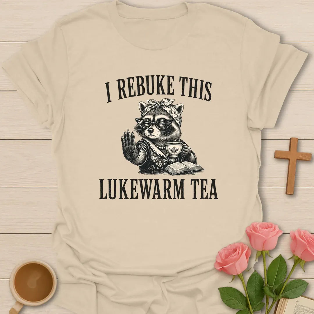 Rebuke Lukewarm Tea shirt with teacup, playful lettering, and faith-inspired design. - Sand