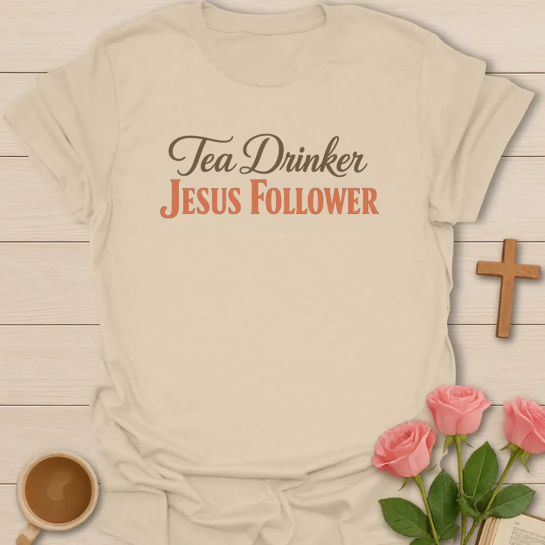 Tea Drinker Jesus Follower shirt with teacup, cross, and cream vintage lettering. - Sand
