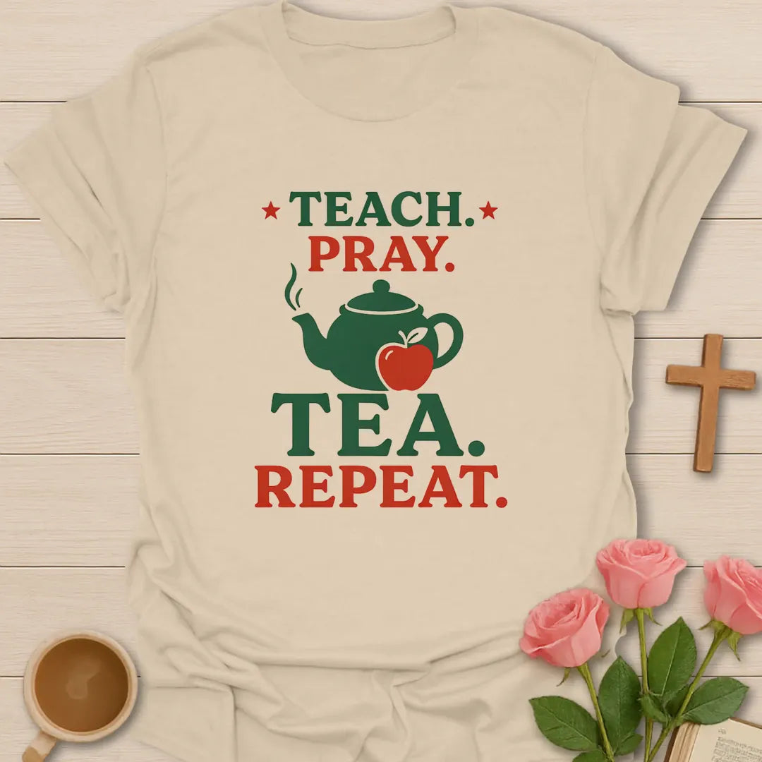 Teach Pray Tea Repeat shirt with stacked red and green lettering, green teapot silhouette, red apple, stars, and vintage distressed texture. - Sand