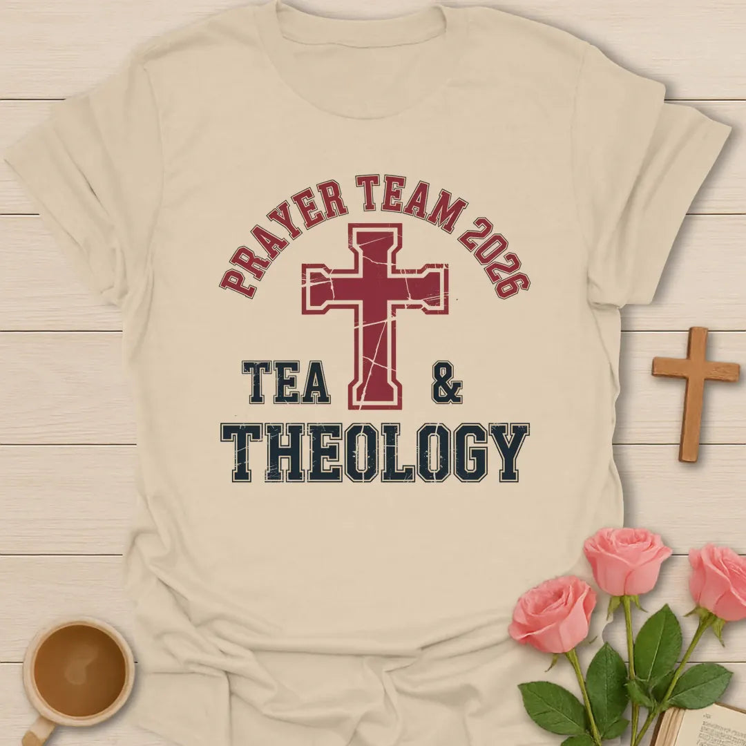 Tea and Theology shirt with teacup, book, and cream vintage lettering. - Sand