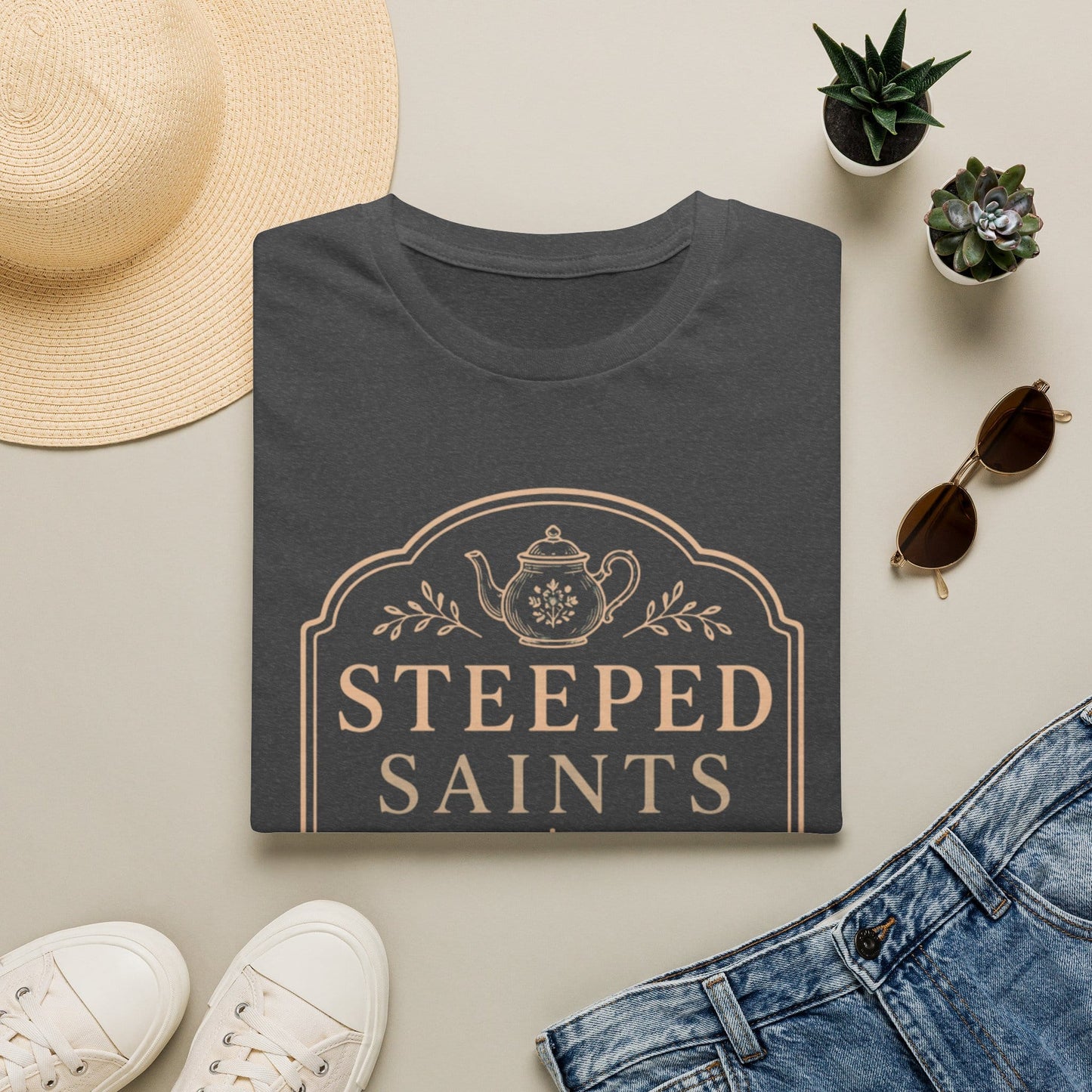 Steeped Saints shirt with teacup, cross, and cream vintage lettering.
