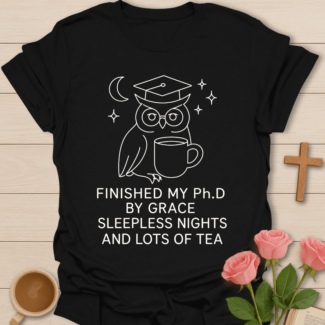 Wise Owl Dissertation Finished shirt with graduate owl, books, graduation cap, and cream lettering. - Black