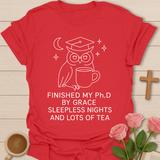 Wise Owl Dissertation Finished shirt with graduate owl, books, graduation cap, and cream lettering. - Red