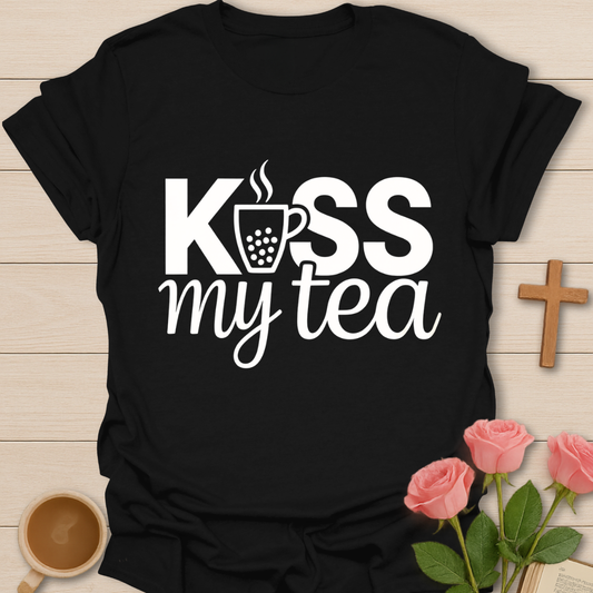 Black Kiss My Tea graphic t-shirt design with bold lettering and a steaming tea cup icon on a dark background