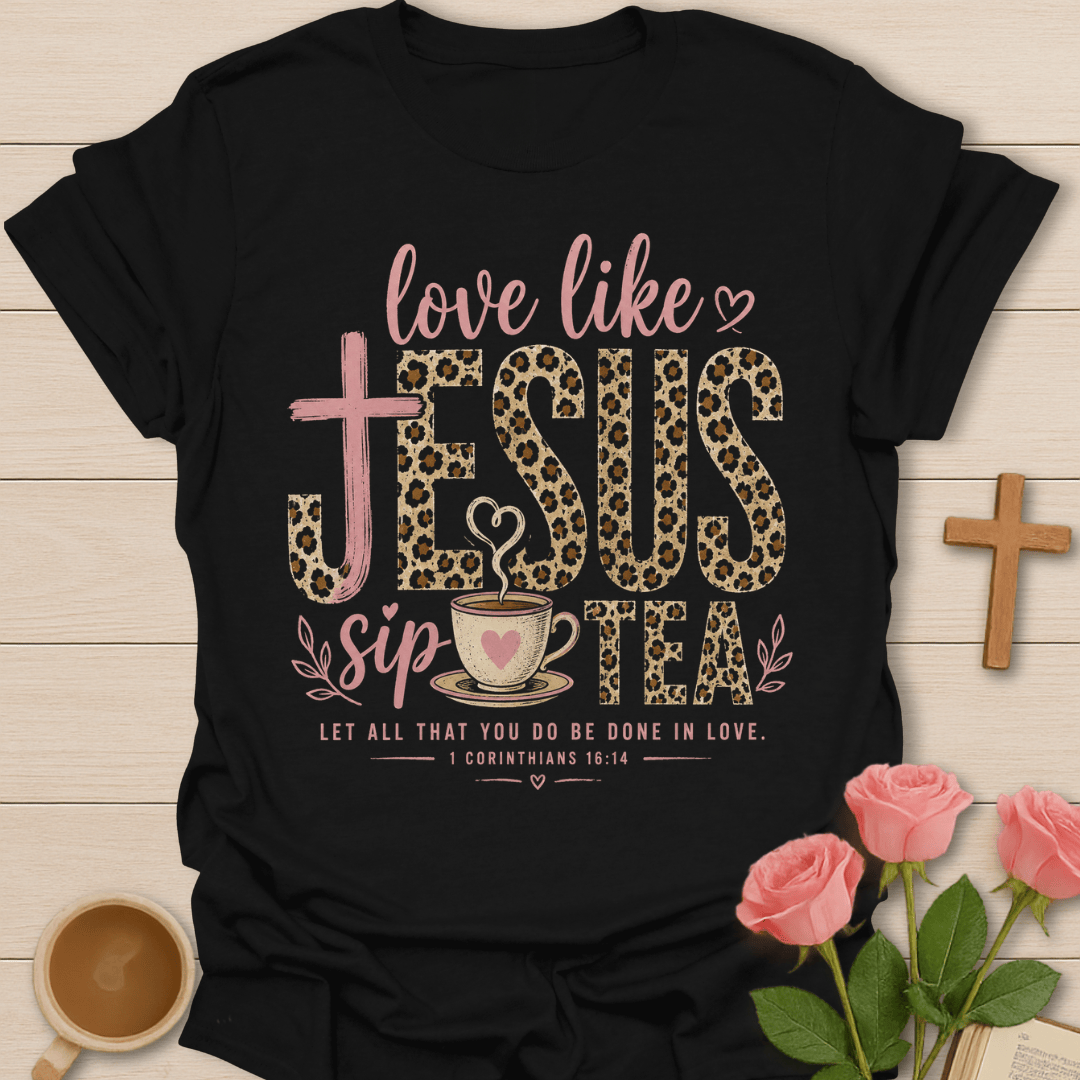 Love Like Jesus Sip Tea shirt with leopard JESUS lettering, teacup, cross, heart, and 1 Corinthians 16:14 text. - Black