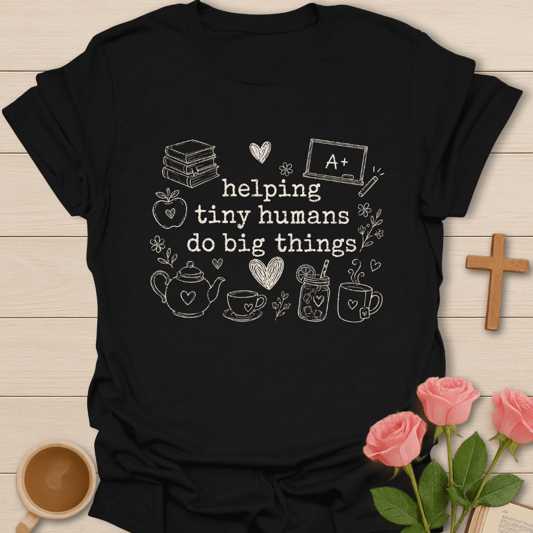 Helping Tiny Humans shirt with cream typewriter-style text, school books, apple, chalkboard, tea cups, teapot, flowers, and heart doodles.