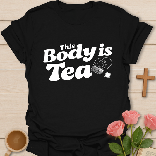 Black graphic t-shirt design with the phrase “This Body Is Tea” and a hanging tea bag illustration