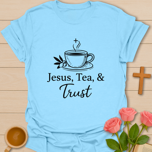 Light Blue Christian women’s faith t-shirt featuring Jesus Tea and Trust design with cross, tea cup, and peaceful inspirational artwork