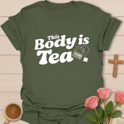 Green graphic t-shirt design with the phrase “This Body Is Tea” and a hanging tea bag illustration