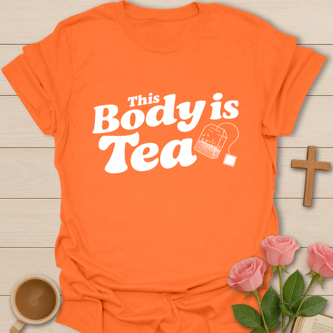 Orange graphic t-shirt design with the phrase “This Body Is Tea” and a hanging tea bag illustration