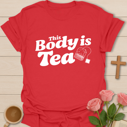 Red graphic t-shirt design with the phrase “This Body Is Tea” and a hanging tea bag illustration