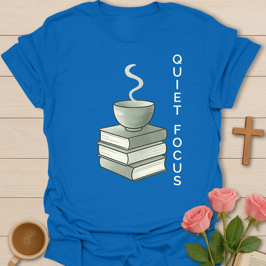 Royal blue Christian Quiet Focus shirt featuring a teacup on stacked books symbolizing faith, prayer, Bible study, and calm Christian lifestyle