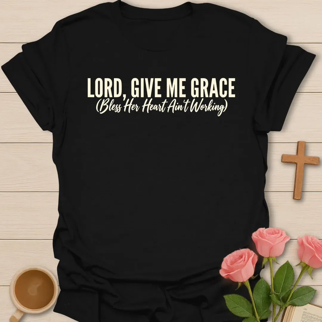 Lord, Give Me Grace (Bless Her Heart Ain't Working) t-shirt with bold cream lettering and a script subtitle - Black