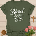 Blessed Child Of God shirt with white script lettering and simple faith-based typography. - Military Green