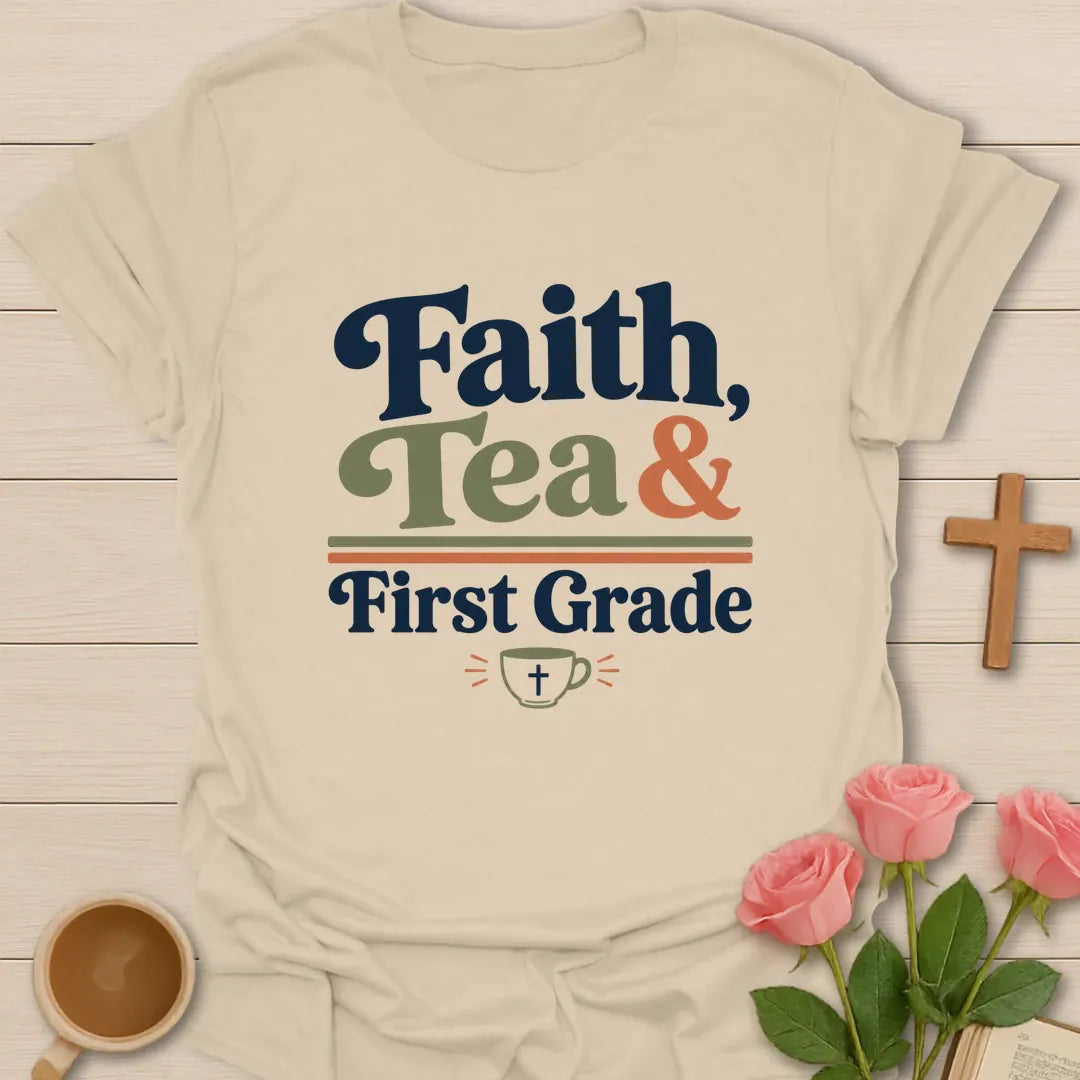 Faith Tea and First Grade shirt with navy, sage, and coral typography, double divider lines, and small teacup with cross. - Sand