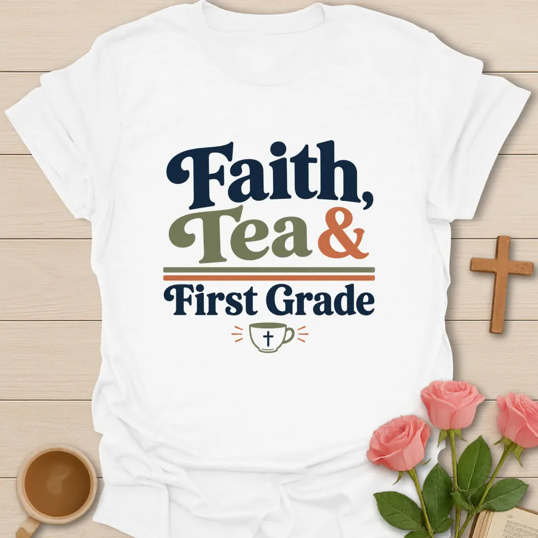 Faith Tea and First Grade shirt with navy, sage, and coral typography, double divider lines, and small teacup with cross. - White