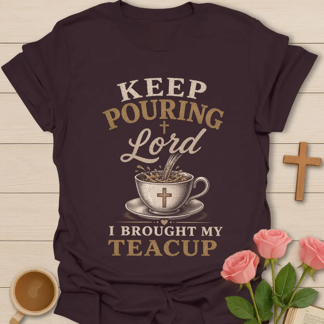 Keep Pouring Lord, I Brought My Teacup t-shirt with vintage lettering and tea pouring into a cross-marked teacup. - Dark Chocolate