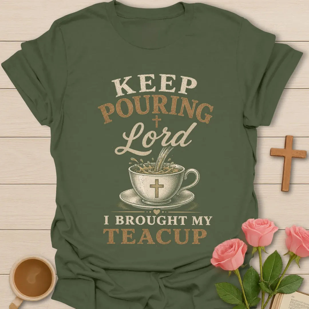 Keep Pouring Lord, I Brought My Teacup t-shirt with vintage lettering and tea pouring into a cross-marked teacup. - Military Green