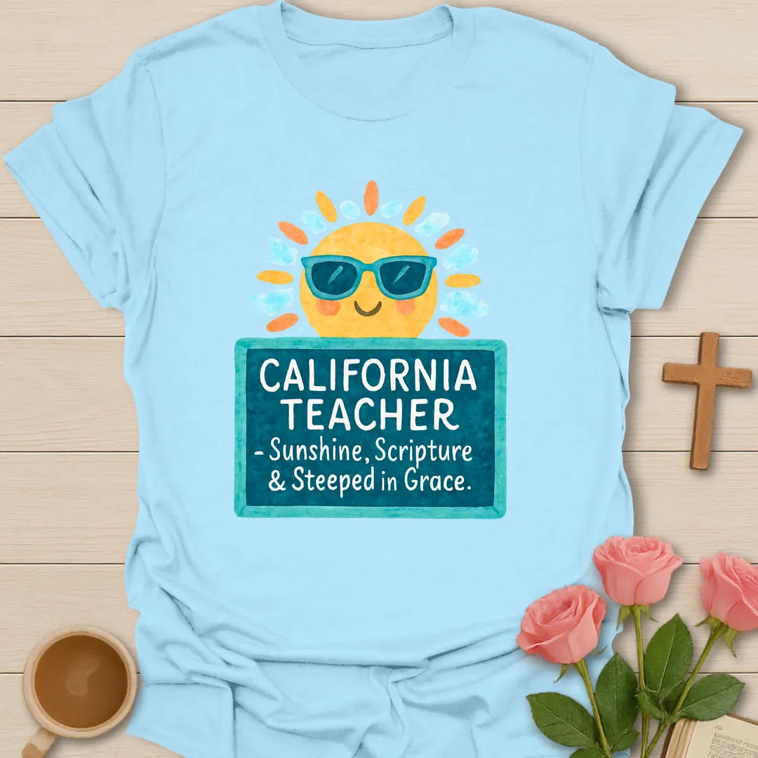 California Teacher shirt with smiling sun in sunglasses, teal sign, white handwritten lettering, and bright watercolor-style colors. - Light Blue