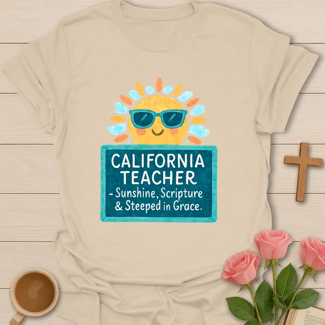 California Teacher shirt with smiling sun in sunglasses, teal sign, white handwritten lettering, and bright watercolor-style colors. - Sand