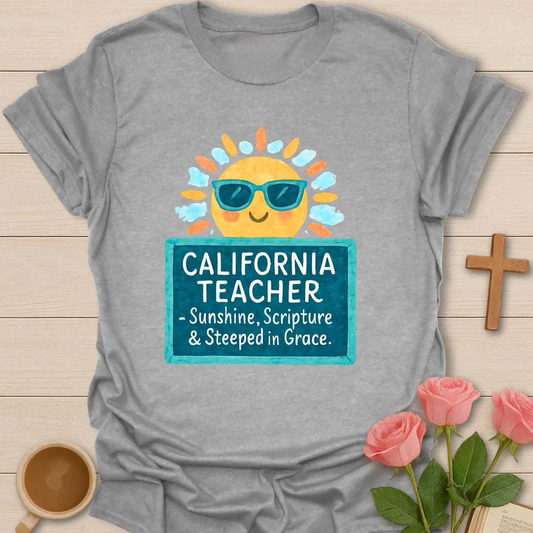 California Teacher shirt with smiling sun in sunglasses, teal sign, white handwritten lettering, and bright watercolor-style colors. - Sport Grey