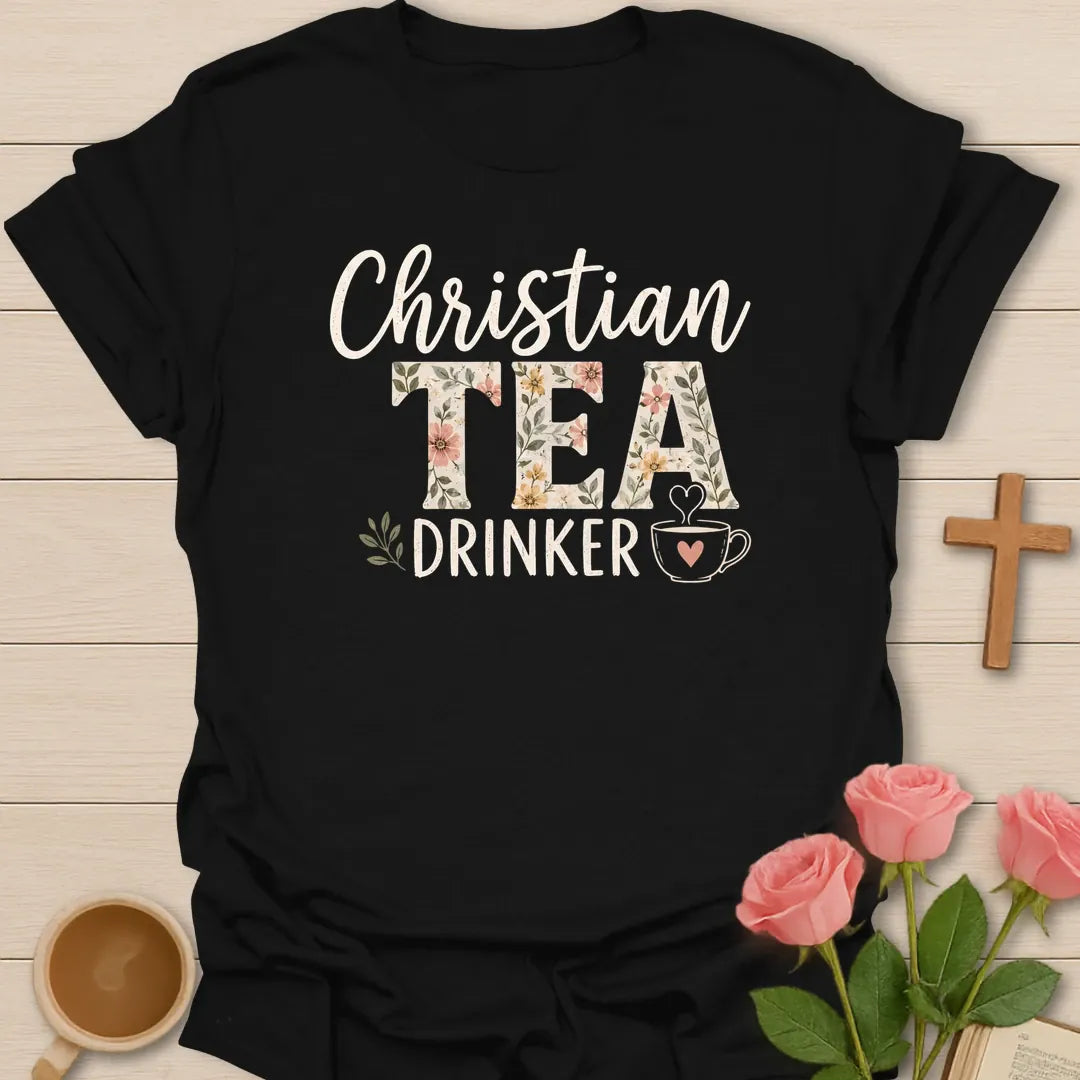Christian Tea Drinker shirt with floral TEA lettering, teacup, heart steam, leaves, and cream hand-lettered typography. - Black