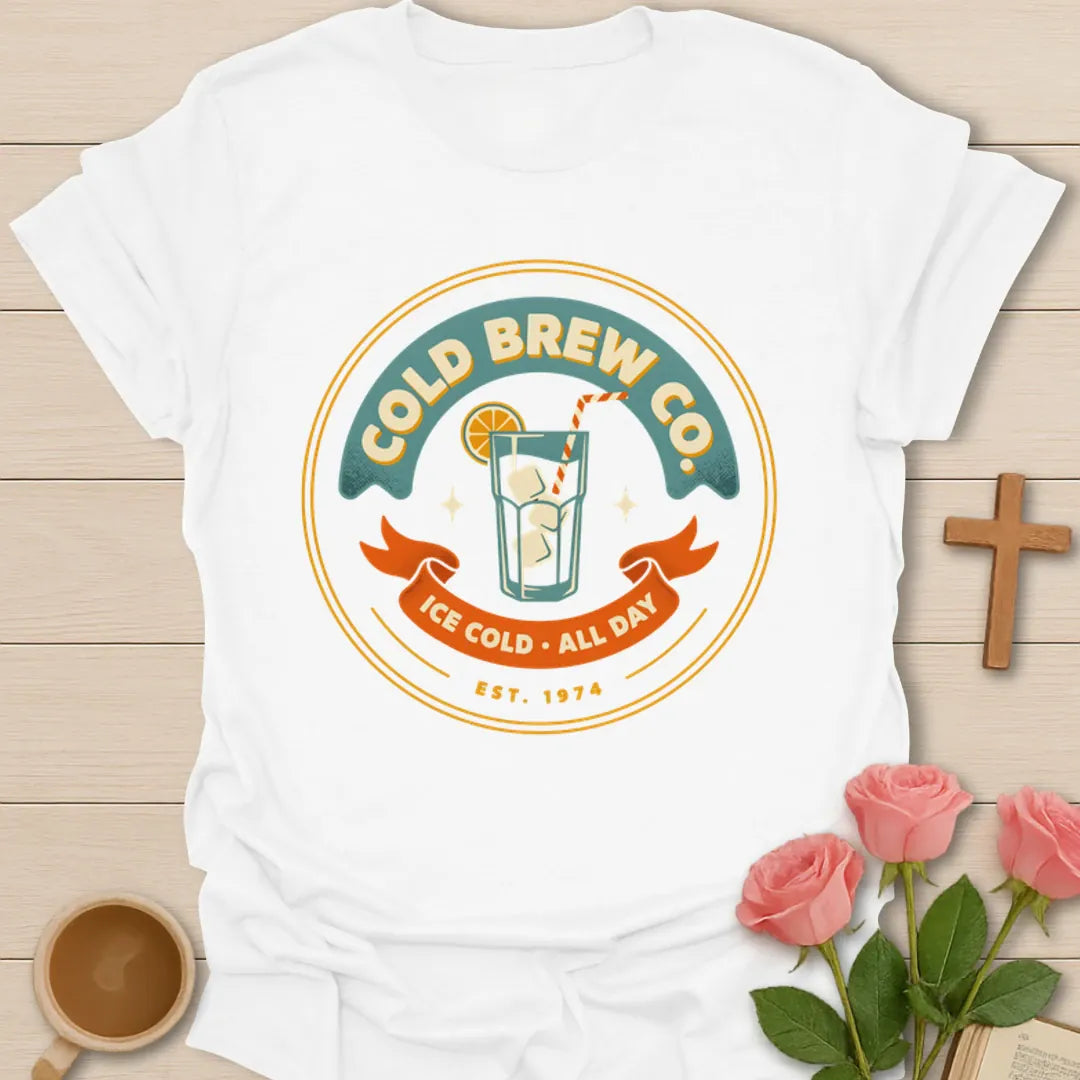 Cold Brew Co iced tea shirt with vintage badge, iced drink, orange slice, straw, stars, and Ice Cold All Day text - White