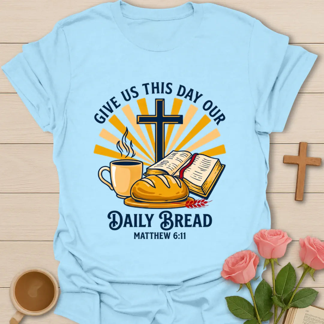 Daily Bread Christian shirt with open Bible, bread, cross, sun rays, and coffee cup. - Light Blue