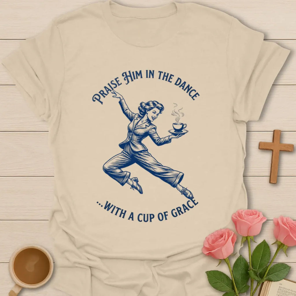 Dance With A Cup Of Grace shirt with dancer holding a steaming cup and vintage blue line art. - Sand