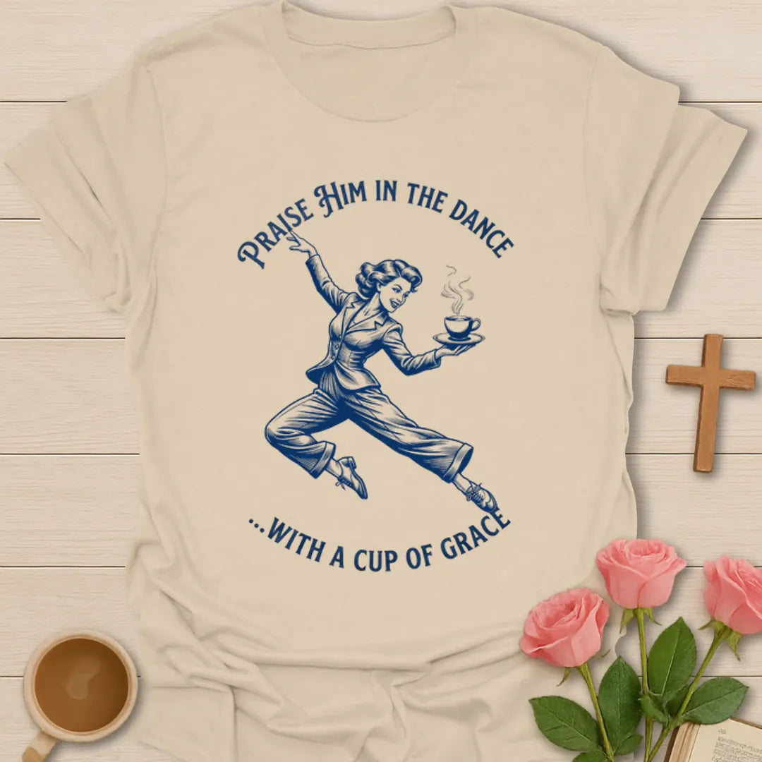 Dance With A Cup Of Grace shirt with dancer holding a steaming cup and vintage blue line art. - Sand
