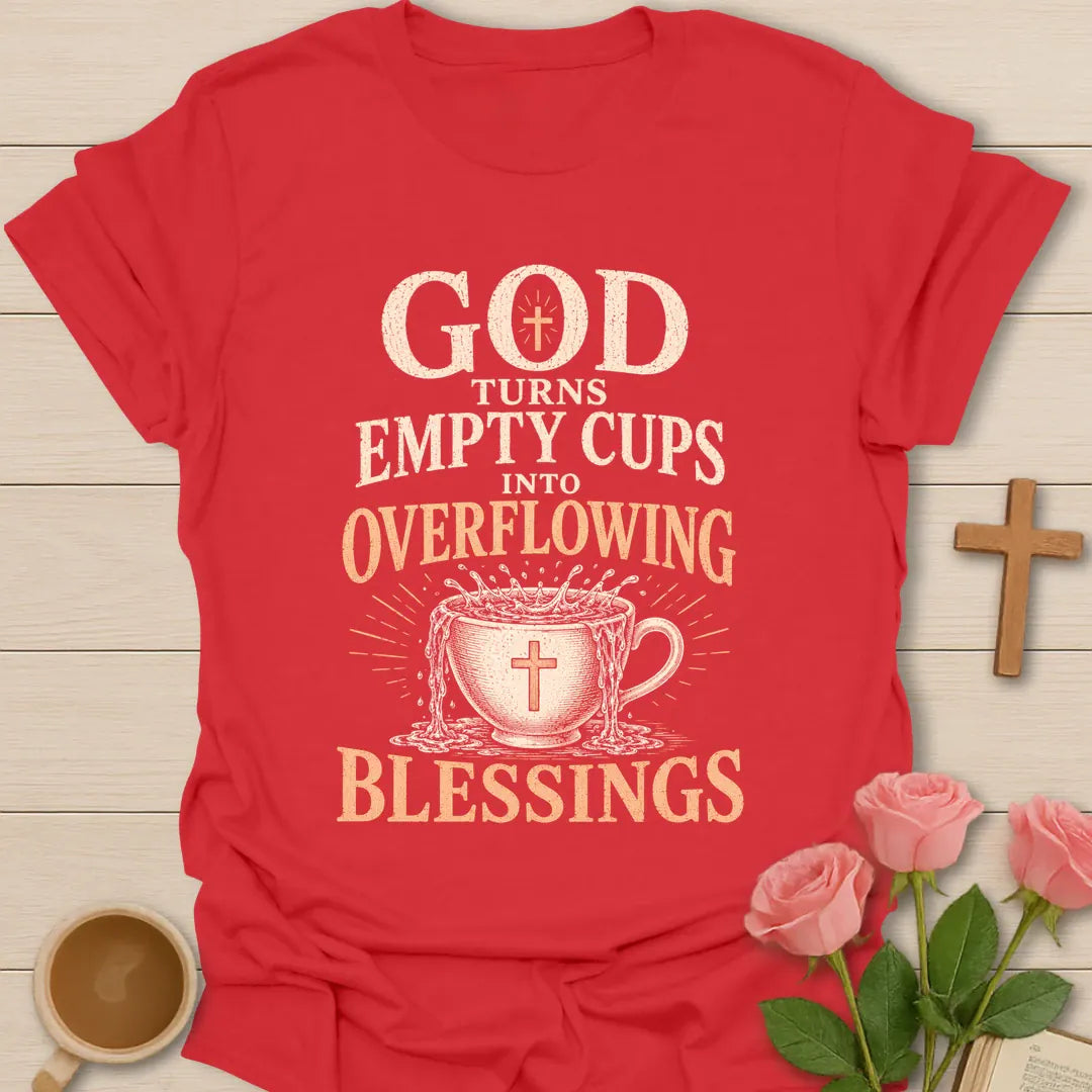 God Turns Empty Cups Into Overflowing Blessings t-shirt with vintage lettering and an overflowing teacup marked with a cross. - Red
