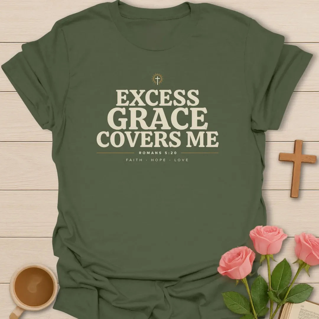 Excess Grace Covers Me shirt with bold cream lettering, small cross, Romans 5:20 text, and faith hope love accents. - Military Green