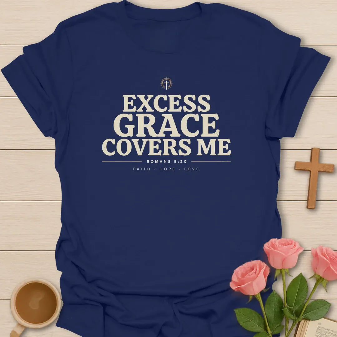 Excess Grace Covers Me shirt with bold cream lettering, small cross, Romans 5:20 text, and faith hope love accents. - Navy