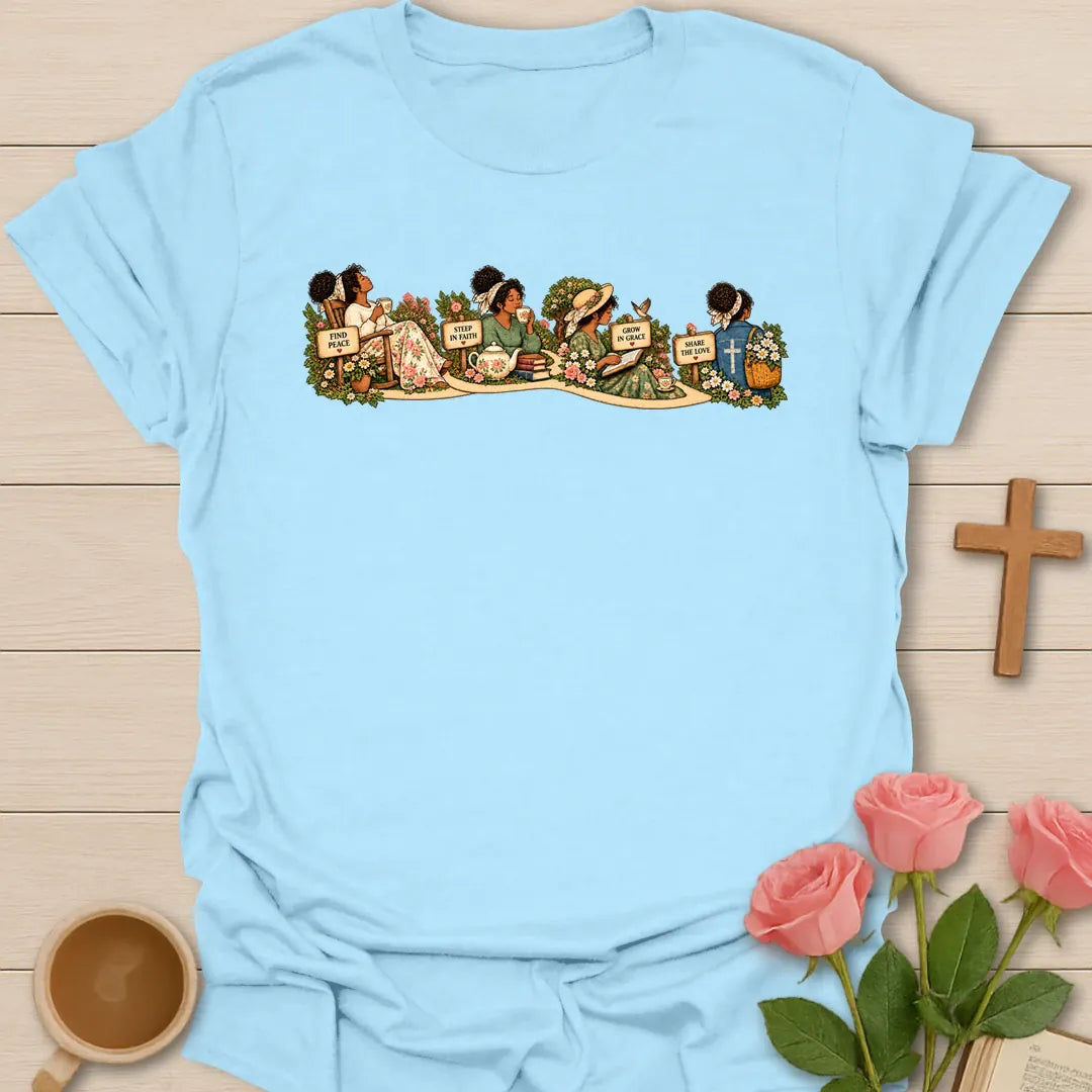 Faith Garden Journey t-shirt with women sipping tea along a flower garden path with signs reading Find Peace, Steep In Faith, Grow In Grace and Share The Love - Light Blue
