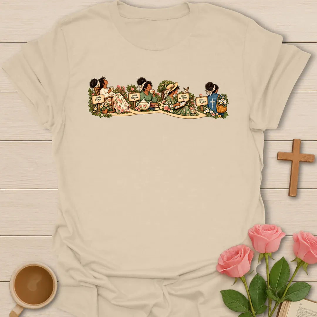 Faith Garden Journey t-shirt with women sipping tea along a flower garden path with signs reading Find Peace, Steep In Faith, Grow In Grace and Share The Love - Sand