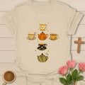 Fall Pumpkin Tea Cross Christian t-shirt with autumn motif and faith-inspired lettering - Sand