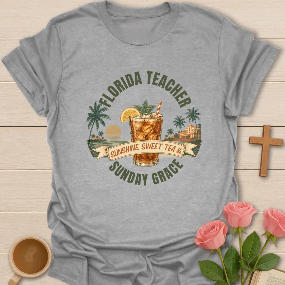 Florida Teacher shirt with arched green text, iced sweet tea glass, orange slice, palms, sunset, ribbon banner, and Sunday Grace wording. - Sport Grey