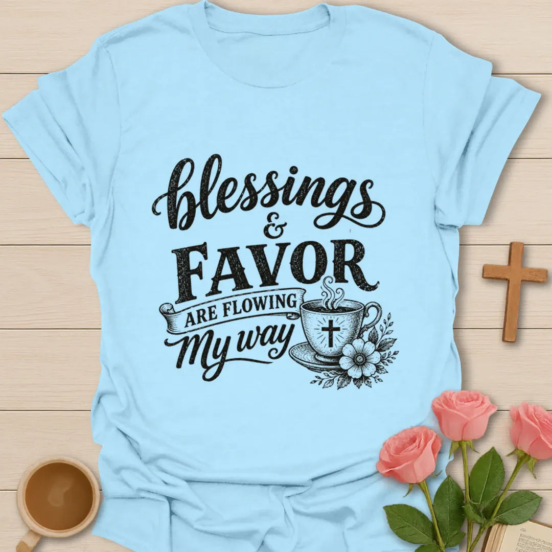 Blessings and Favor Are Flowing My Way shirt with cross cup, flowers, and vintage black lettering. - Light Blue