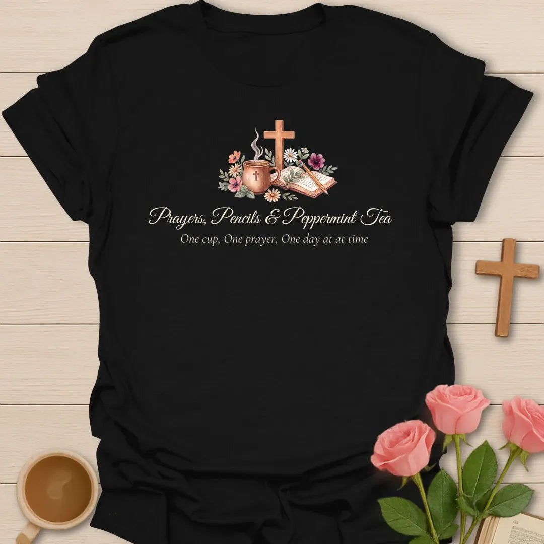 Prayers Pencils and Peppermint Tea shirt with teacup, cross, open Bible, flowers, pencil, and soft script lettering. - Black