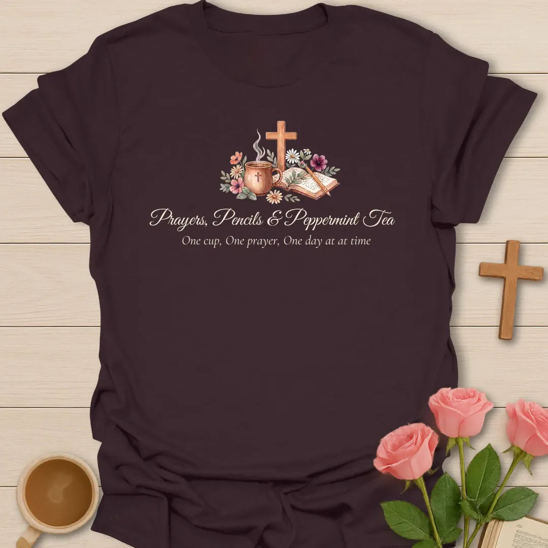 Prayers Pencils and Peppermint Tea shirt with teacup, cross, open Bible, flowers, pencil, and soft script lettering. - Dark Chocolate