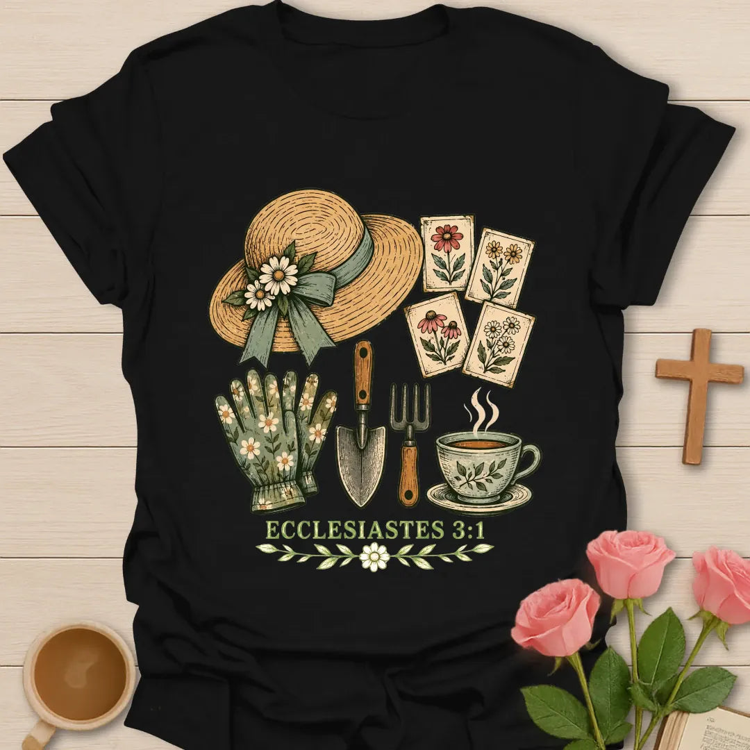Gardening Faith Christian t-shirt with a straw sun hat, flower seed packets, gloves, trowel, garden fork, teacup and Ecclesiastes 3:1 - Black