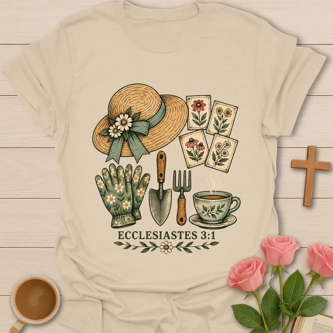 Gardening Faith Christian t-shirt with a straw sun hat, flower seed packets, gloves, trowel, garden fork, teacup and Ecclesiastes 3:1 - Sand