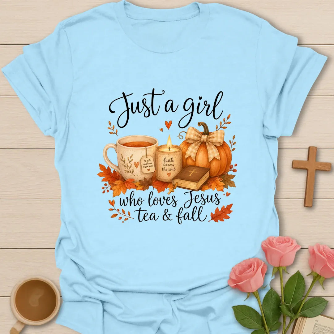 Just A Girl Loving Jesus Tea and Fall shirt with teacup, pumpkins, leaves, and cream lettering. - Light Blue