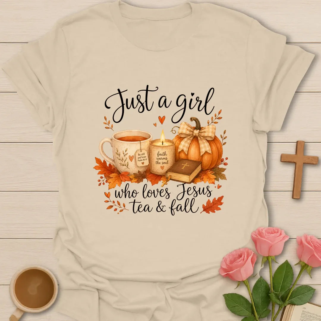 Just A Girl Loving Jesus Tea and Fall shirt with teacup, pumpkins, leaves, and cream lettering. - Sand