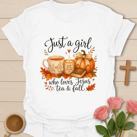 Just A Girl Loving Jesus Tea and Fall shirt with teacup, pumpkins, leaves, and cream lettering. - White