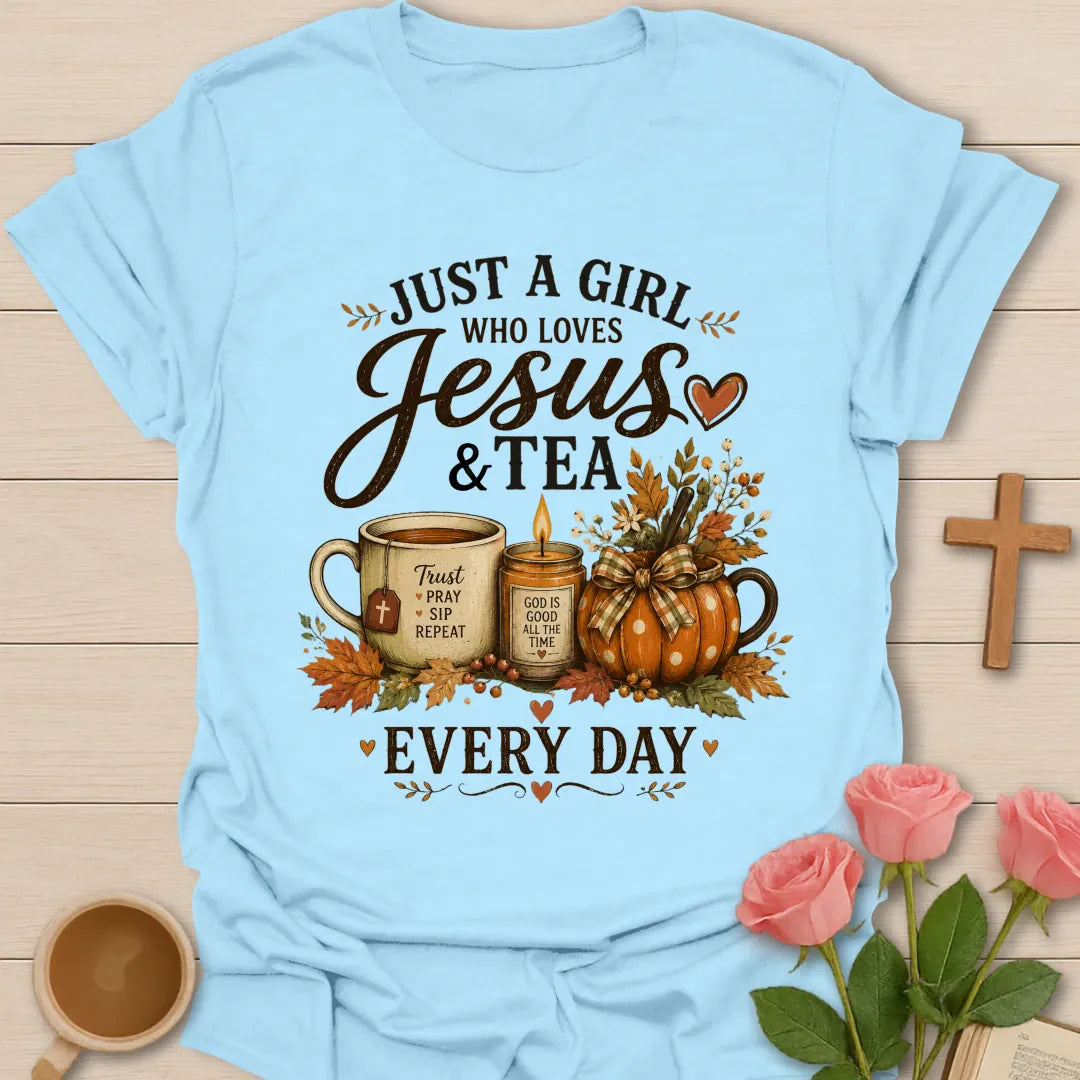 Girl who loves Jesus and tea every day shirt with teacup, candle, pumpkins, fall leaves, and faith message. - Light Blue