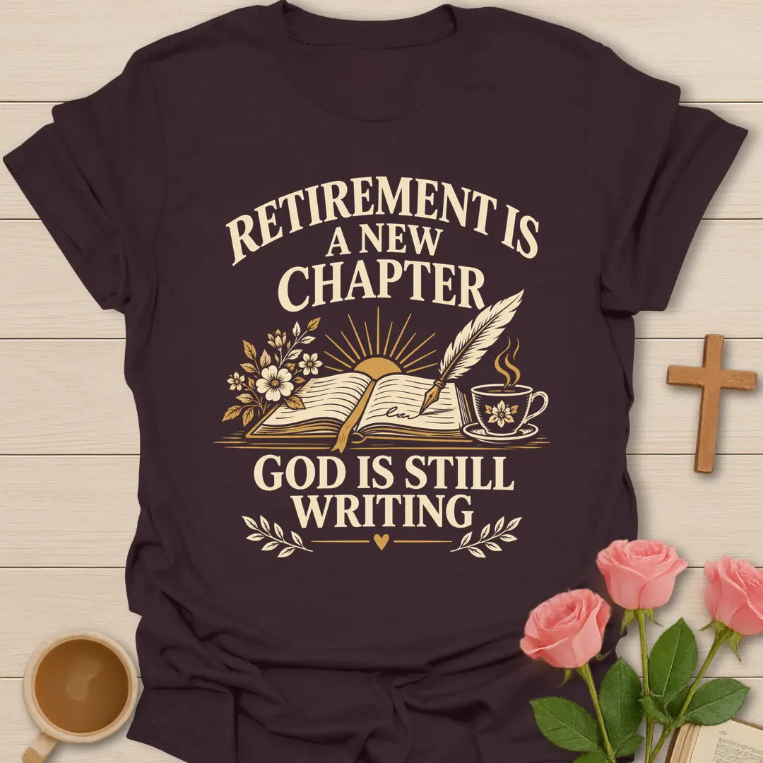 Retirement Is A New Chapter, God Is Still Writing t-shirt with an open book, quill pen, sunrise and a teacup - Dark Chocolate