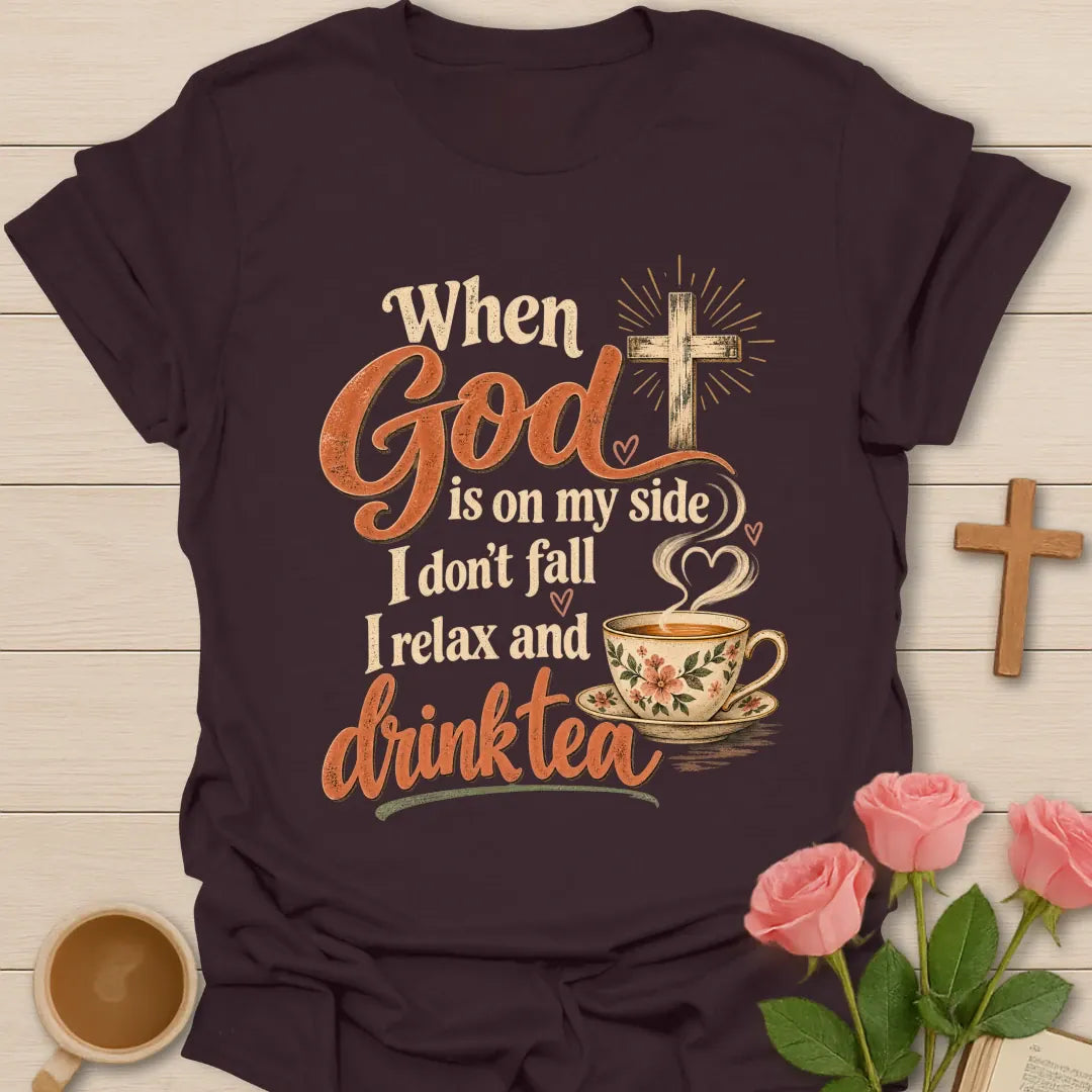 When God Is On My Side I Don't Fall, I Relax And Drink Tea t-shirt with a glowing cross and floral teacup in script lettering - Dark Chocolate