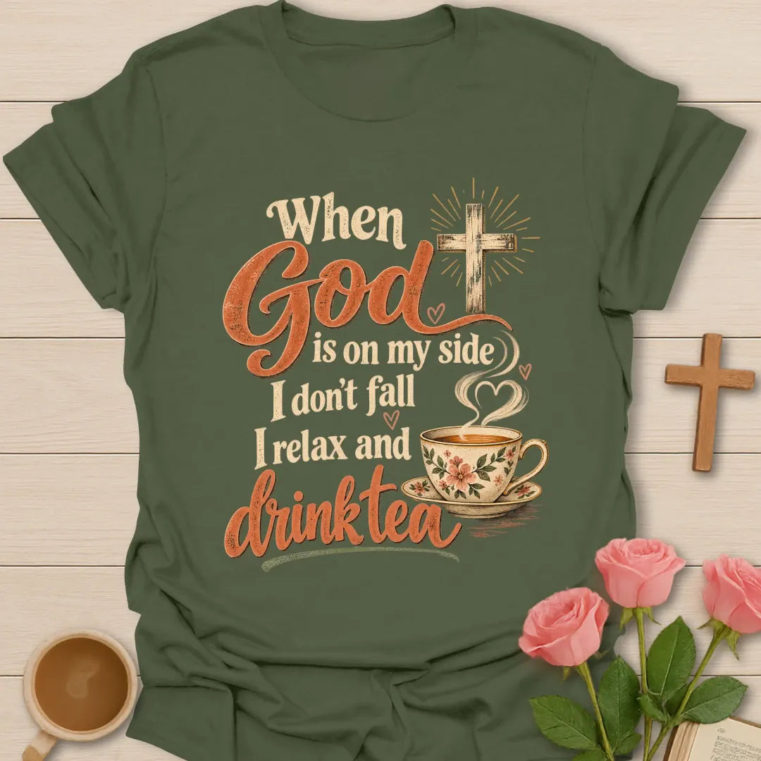 When God Is On My Side I Don't Fall, I Relax And Drink Tea t-shirt with a glowing cross and floral teacup in script lettering - Military Green